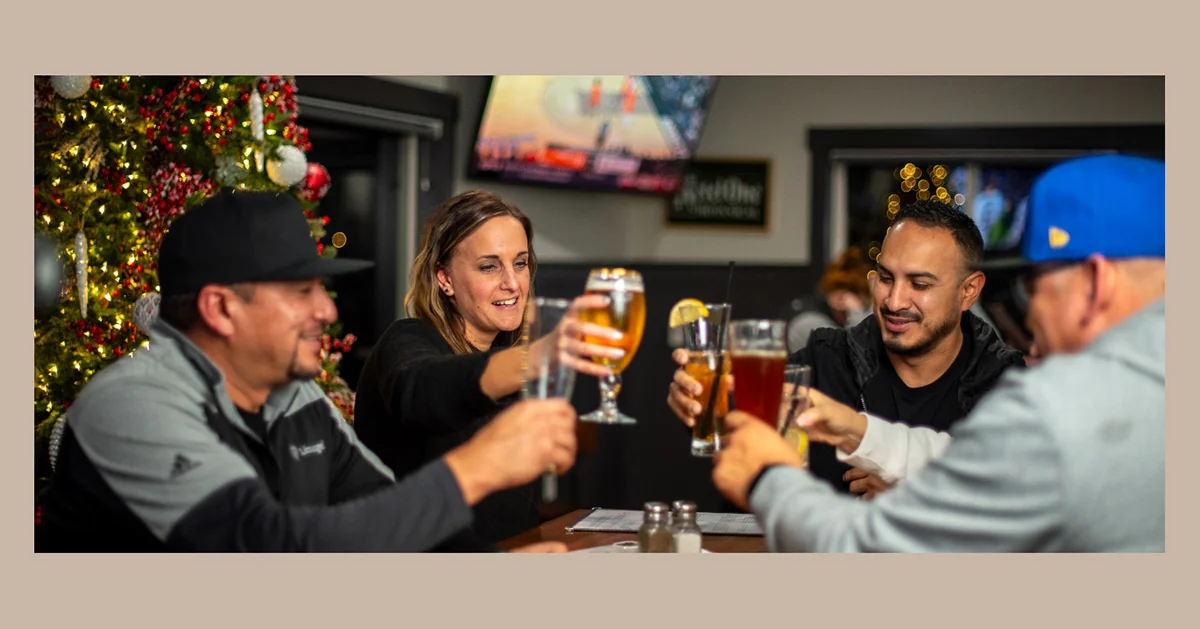Friends raising a glass together